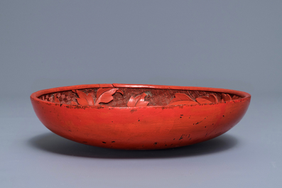 A Chinese cinnabar lacquer dish with floral design, 18/19th C.