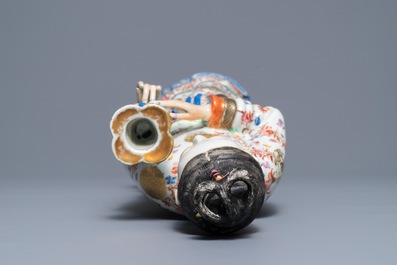 A large Chinese famille rose candle holder modelled as court lady, Qianlong