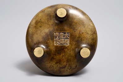 A Chinese bronze tripod censer, Xuande mark, Ming