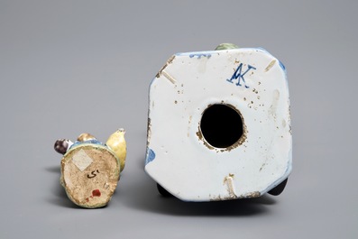Two polychrome Dutch Delft models of a bagpipe player and a lady, 19th C.