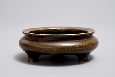 A Chinese bronze tripod censer, Xuande mark, Ming