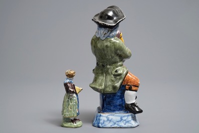 Two polychrome Dutch Delft models of a bagpipe player and a lady, 19th C.