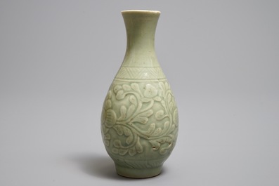 A Chinese relief-decorated celadon 'peony' vase, 18/19th C.