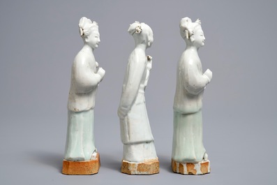 Three Chinese white- and celadon glazed biscuit figures, Qianlong