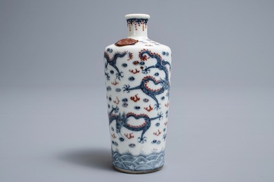 A Chinese blue, white and underglaze red 'dragon' vase, Kangxi mark, 19/20th C.