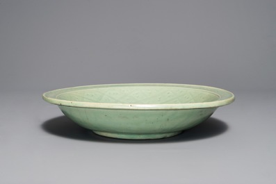 A Chinese Longquan celadon dish with underglaze design of peonies, Ming