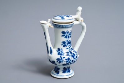 A Chinese blue and white jug and cover after a pewter example, Kangxi
