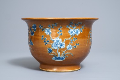 A Chinese blue and white on brown ground cachepot, 19th C.