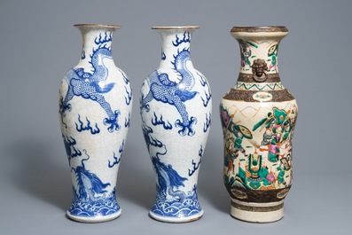 A pair of Chinese Nanking 'dragon' vases and a 'warrior' vase, 19th C.