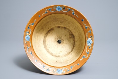 A Chinese blue and white on brown ground cachepot, 19th C.