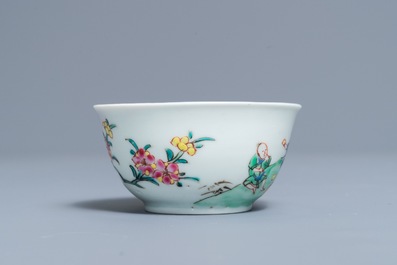 A fine Chinese famille rose cup and saucer with a river scene, Yongzheng