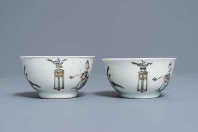 A pair of Chinese grisaille and gilt cups and saucers, Qianlong