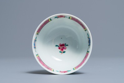 A fine Chinese famille rose cup and saucer with a river scene, Yongzheng