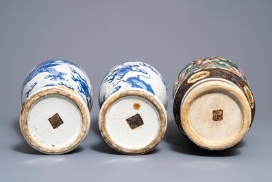 A pair of Chinese Nanking 'dragon' vases and a 'warrior' vase, 19th C.