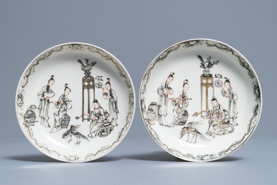 A pair of Chinese grisaille and gilt cups and saucers, Qianlong