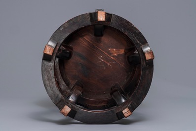A Chinese famille rose plaque-topped wooden stand, 19/20th C.