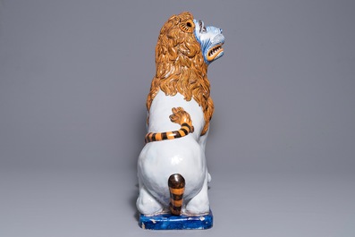 A massive French faience model of a lion, Rouen, late 19th C