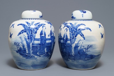 A pair of Chinese blue and white jars and covers with figures in a garden, Kangxi mark, 19th C.