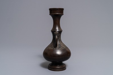 Een Chinese bronzen vaas met reli&euml;fdecor, Yuan/Ming