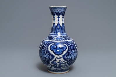 A Chinese blue and white bottle vase, Kangxi mark, 19th C.