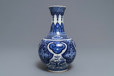 A Chinese blue and white bottle vase, Kangxi mark, 19th C.