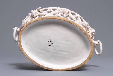 A white-glazed reticulated 'grape vines' basket, France or Italy, 19th C.
