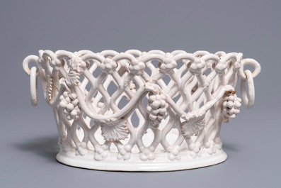 A white-glazed reticulated 'grape vines' basket, France or Italy, 19th C.