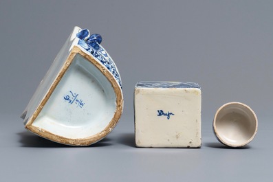 A Delft-style blue and white covered tea caddy and a wall vase, France, 19th C.