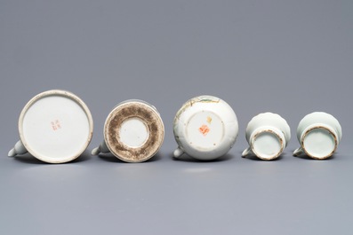 Three Chinese famille rose and qianjiang cai teapots and five cups, 19/20th C.