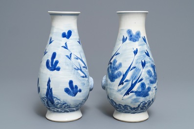 A pair of Chinese blue and white 'fish and crab' vases, Kangxi mark, 19th C.