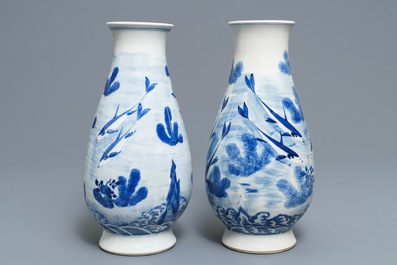 A pair of Chinese blue and white 'fish and crab' vases, Kangxi mark, 19th C.