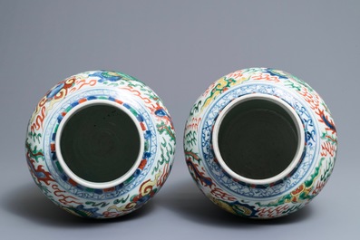 A pair of Chinese wucai &lsquo;dragon and phoenix&rsquo; vases, Transitional period