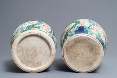 A pair of Chinese wucai &lsquo;dragon and phoenix&rsquo; vases, Transitional period