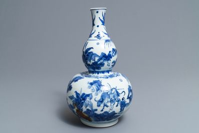 A Chinese blue and white double gourd vase, Transitional period