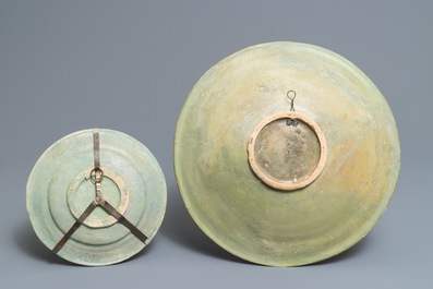 A polychrome Dutch maiolica pomegranates dish and a landscape plate, 17th C.