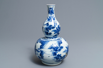 A Chinese blue and white double gourd vase, Transitional period