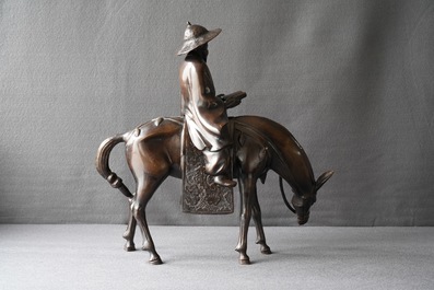 A large Japanese bronze group of a sage on horseback, Meiji, 19th C.