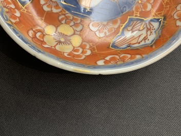 Nine Chinese iron red and gilt cups and eight saucers, Kangxi