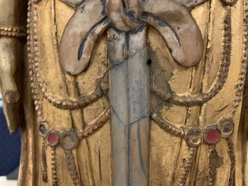 A large Chinese gilt and painted wood figure of Buddha, 19th C.