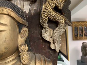 A large Chinese gilt and painted wood figure of Buddha, 19th C.