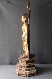 A large Chinese gilt and painted wood figure of Buddha, 19th C.