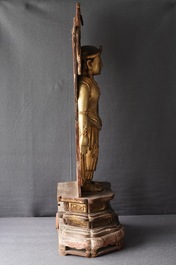 A large Chinese gilt and painted wood figure of Buddha, 19th C.