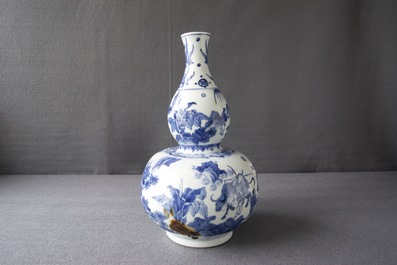 A Chinese blue and white double gourd vase, Transitional period