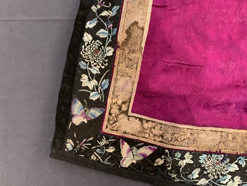 A Chinese informal Manchu embroidered silk pink-ground women's robe, 19th C.