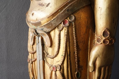 A large Chinese gilt and painted wood figure of Buddha, 19th C.