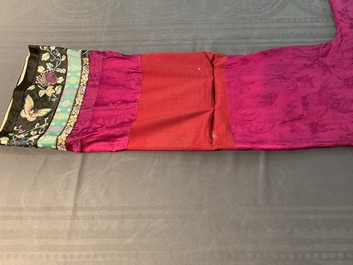 A Chinese informal Manchu embroidered silk pink-ground women's robe, 19th C.