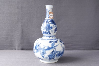 A Chinese blue and white double gourd vase, Transitional period