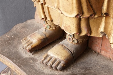A large Chinese gilt and painted wood figure of Buddha, 19th C.