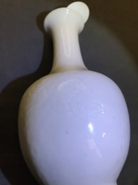 A Chinese blanc de Chine bottle vase with incised anhua design, ca. 1900