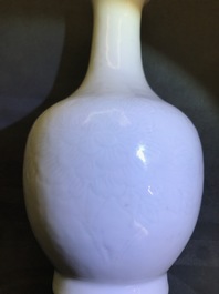 A Chinese blanc de Chine bottle vase with incised anhua design, ca. 1900
